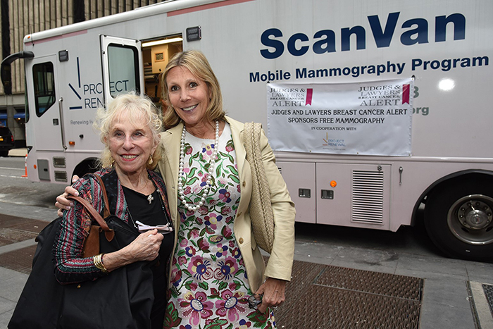 Hon. Sondra Miller and Faith Miller in font of a mobile scan van